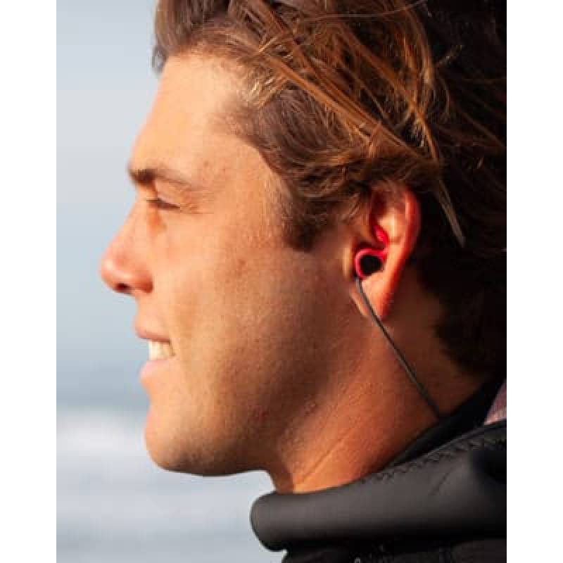 SurfEars 3.0 surf ear plugs worn by surfer