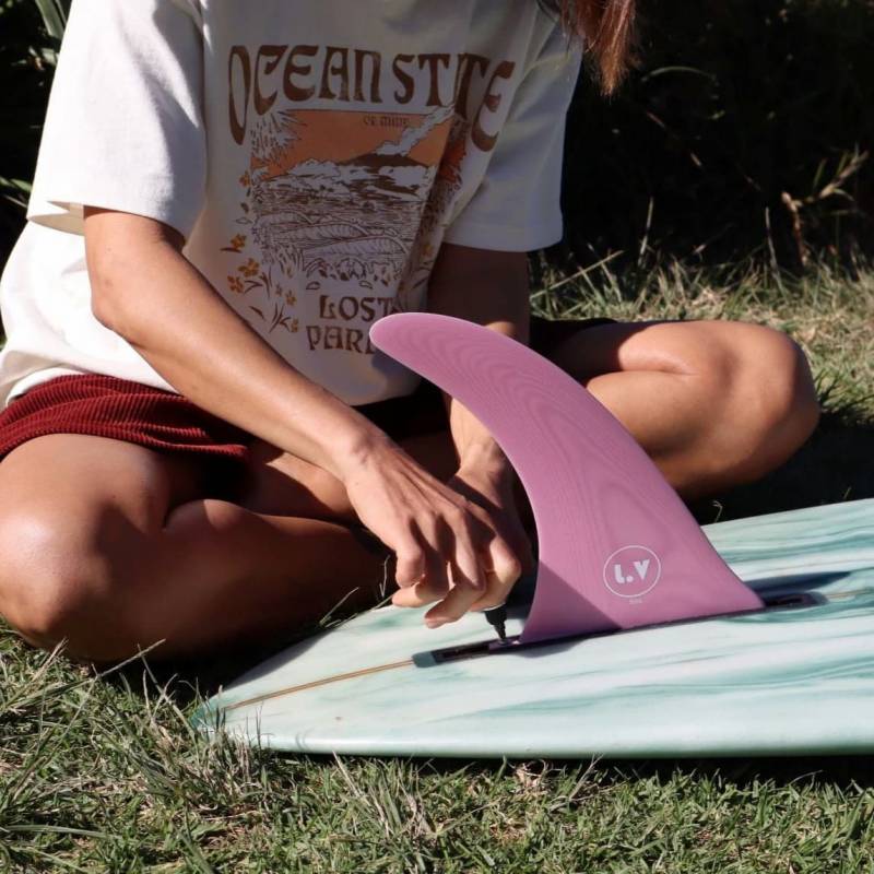 LVfins LB Classic Raked Single Fin - Pink getting attached to a longboard