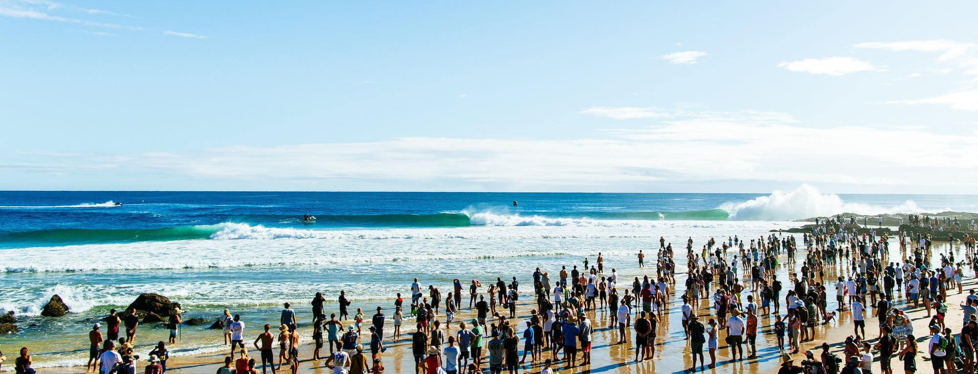 Crowd of spectators watching surfing at Snapper Rocks, QLD Australia