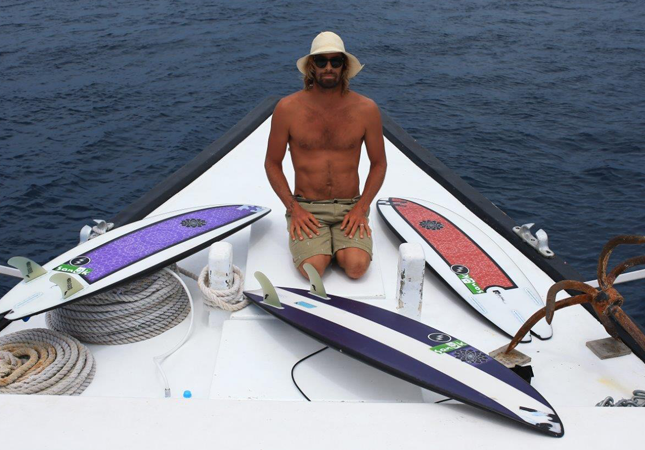 dave rastovich with his holiday quiver